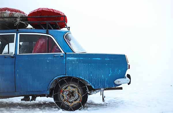 winter emergency car kit blue car in snow