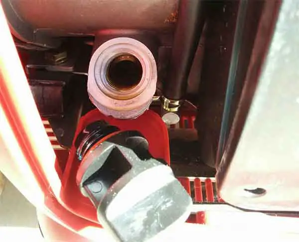 filling up generator for welder oil sump