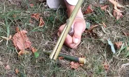 Splitting bamboo fishing spear to make 4 prong fishing spear head.